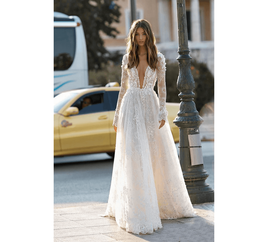 Close-up of 3D floral lace appliques on elegant white wedding dress with built-in bra