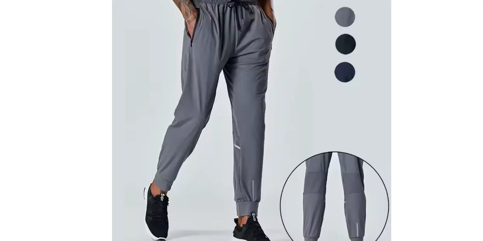 Omnibaya men's navy blue joggers with elastic waistband and tapered fit shown on model