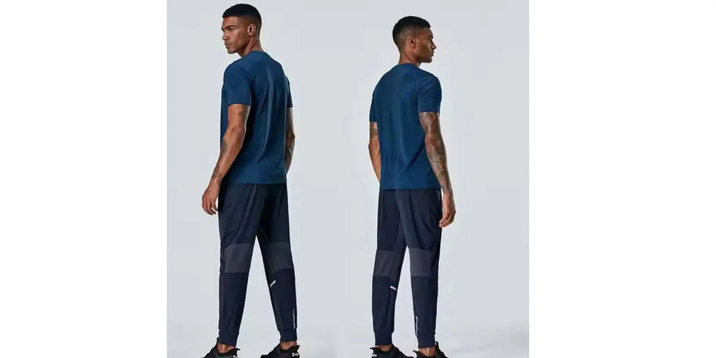 Omnibaya men's navy blue joggers worn by male model showing front and back views
